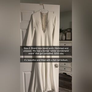 White formal gown
Mesh w rhinestones cut out
Flared bottom